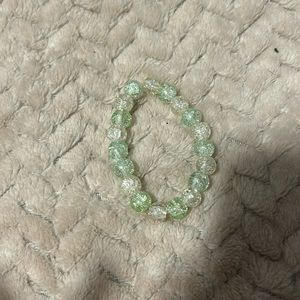 Green and White bracelet, stretchy string. Made by me